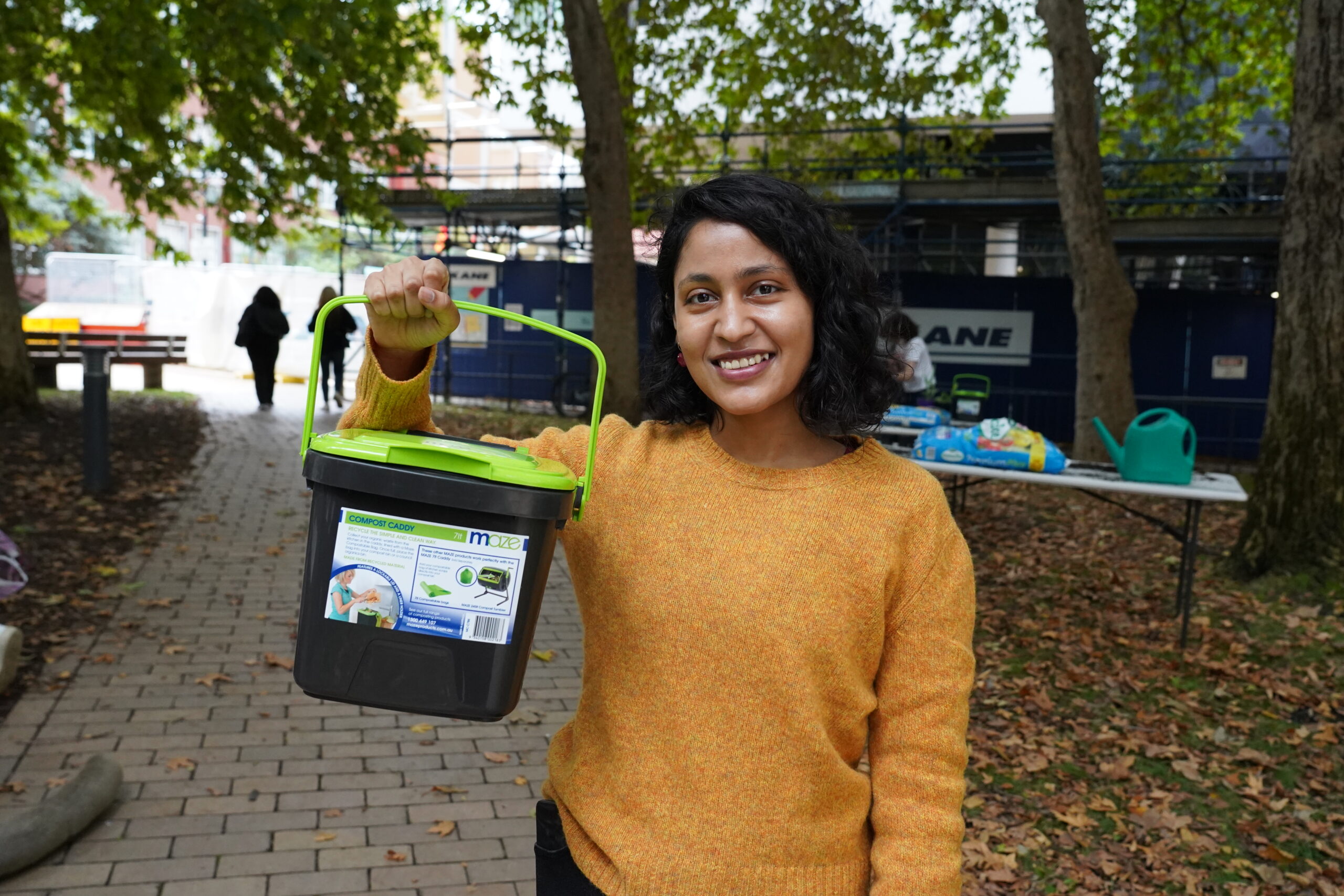 Images of Green Impact participant holding a compost caddy